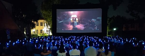 Outdoor cinema with headphones